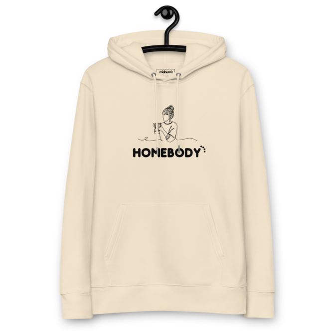 Homebody' hoodie hanging, perfect for relaxed vibes and staying in, beautiful and warm desert dust colour