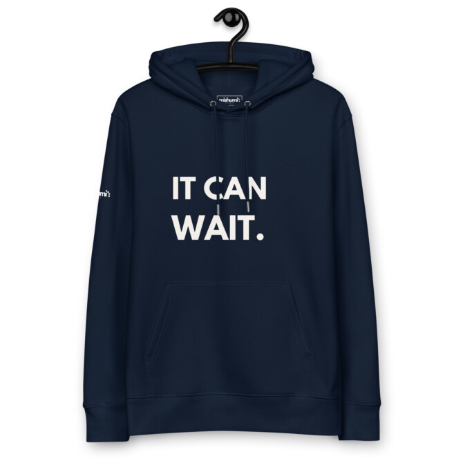 Classic navy 'It Can Wait' hoodie hanging, offering a relaxed and stylish look
