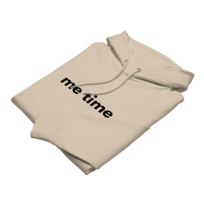 Folded desert dust 'Me Time' hoodie, showcasing its warm, earthy tone and soft fleece fabric
