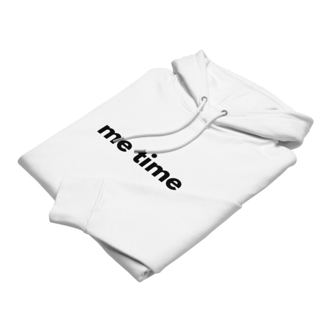 Folded white 'Me Time' hoodie, highlighting its clean design and relaxed fit